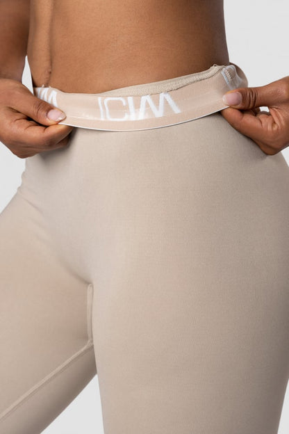 define seamless logo tights wmn sand/white